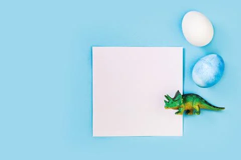Easter egg hunt holiday composition, paper note or list with colorful eggs Photos