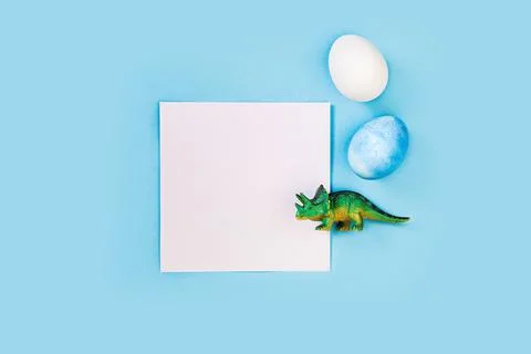 Easter egg hunt holiday composition, paper note or list with colorful eggs Stock Photos