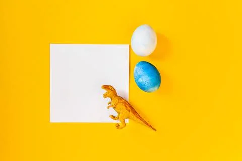Easter egg hunt holiday composition, paper note or list with colorful eggs Stock Photos