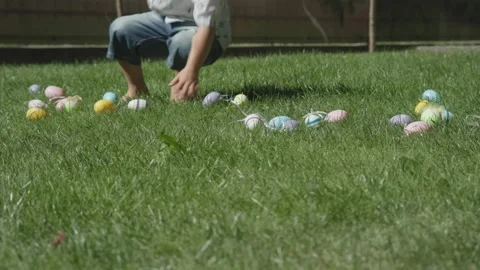 Easter egg hunt traditional spring game falling down colorful easter eggs Stock Footage 232340443