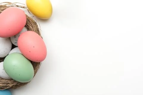 Easter egg layout design with coloured eggs and white copy space Stock Photos