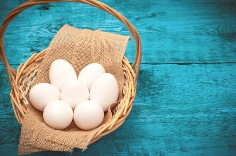 Easter Egg lying in a basket Stock Photos