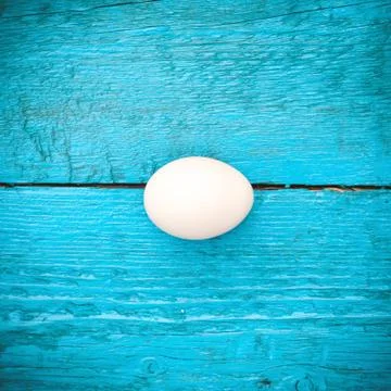Easter Egg lying in a basket Stock Photos