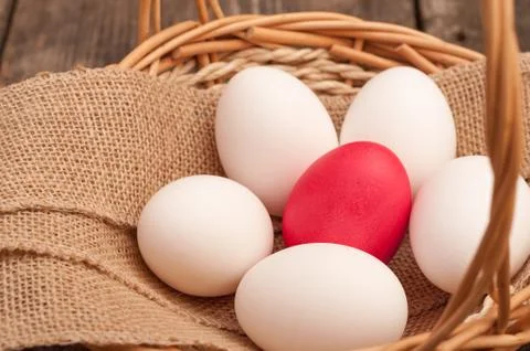 Easter Egg lying in a basket Stock Photos