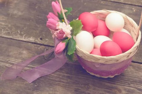 Easter Egg lying in a basket Stock Photos