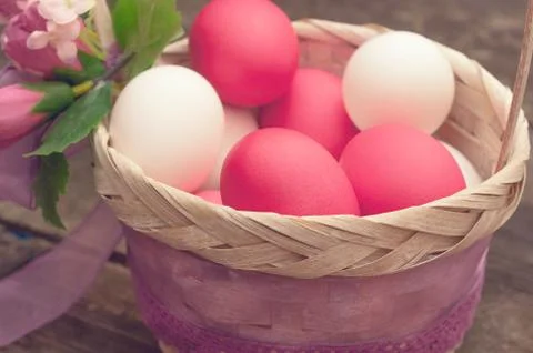 Easter Egg lying in a basket Stock Photos