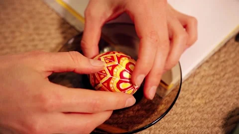 Easter egg with national decor lies on a plate. Easter egg painting. Stock Footage 170125839