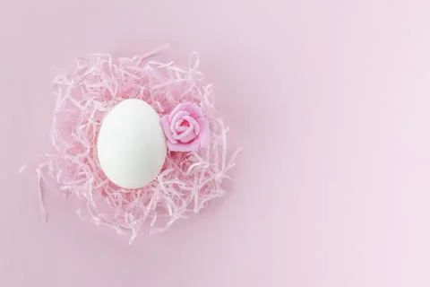 Easter egg in the nest. Easter background.Postcard with space for text in pin Stock Photos