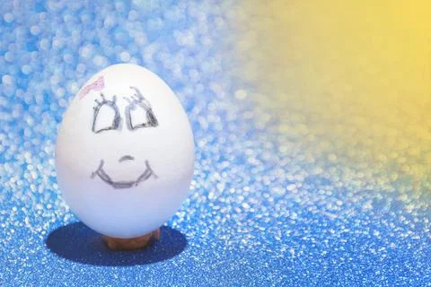 Easter egg with painted fac Stock Photos
