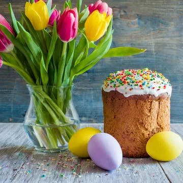 Easter egg panettone bread cake background Happy easter spring holiday tulip Stock Photos