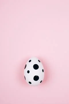 Easter egg on pink. Flat lay style. Stock Photos