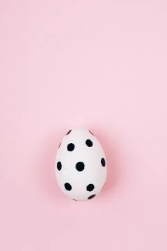 Easter egg on pink. Flat lay style. Stock Photos