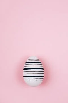Easter egg on pink. Flat lay style. Stock Photos