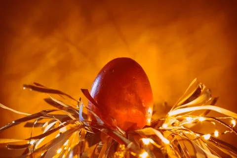 Easter egg rabbit concept on a nest. Stock Photos