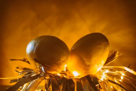 Easter egg rabbit concept on a nest. Stock Photos