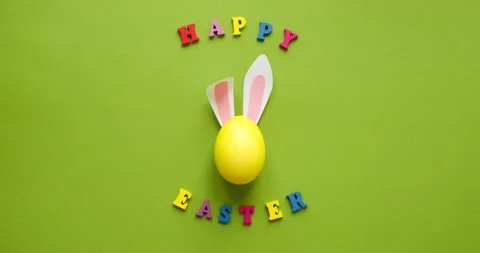 Easter egg with rabbit ears and the inscription Happy Easter Stock Footage 235718311