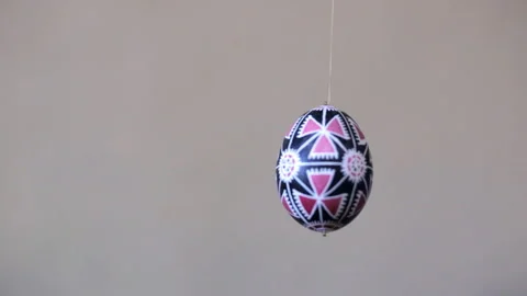Easter egg with a red and black pattern Stock Footage 116708946