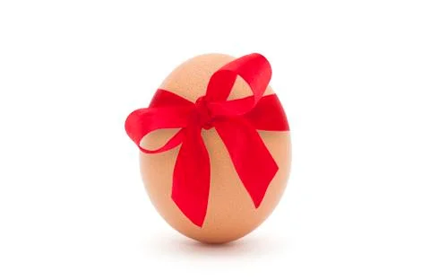 Easter egg with red ribbon isolated on white background Stock Photos