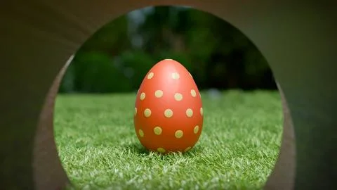 Easter egg resting on green grass, symbolizing the holiday celebration. Stock Illustration