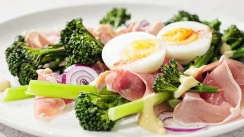 Easter egg salad with prosciutto and broccoli, stock footage video 4k Stock Footage 263819125