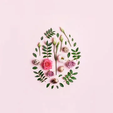 Easter egg shape made of flowers, leaves and quail eggs. Natural Floral patte Stock Photos