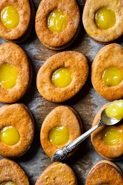 Easter egg shaped cookies pattern. Easter cookies with lemon curd. Traditiona Stock Photos