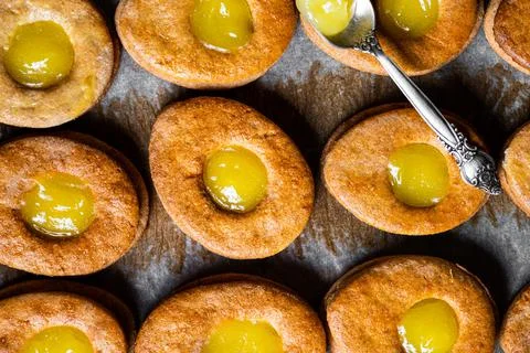 Easter egg shaped cookies pattern. Easter cookies with lemon curd. Traditiona Stock Photos