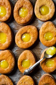 Easter egg shaped cookies pattern. Easter cookies with lemon curd. Traditiona Stock Photos