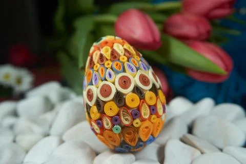 Easter egg on the surface of white stones Stock Photos