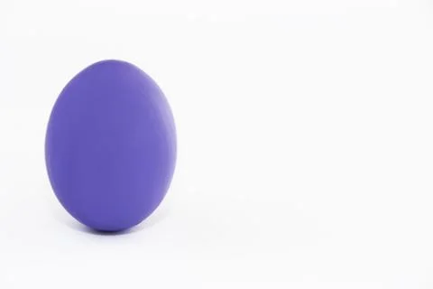 Easter egg of violet color very peri on a white background Stock Photos