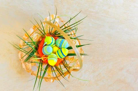 Easter egg in wicker basket Stock Photos