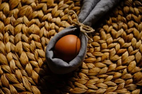 Easter egg wrapped into a rabbit with a napkin Stock Photos