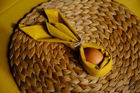 Easter egg wrapped into a rabbit with a napkin Stock Photos