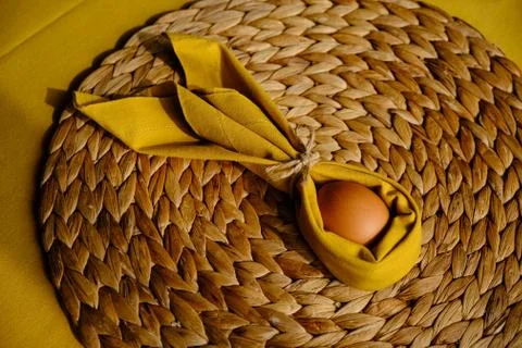 Easter egg wrapped into a rabbit with a napkin Stock Photos