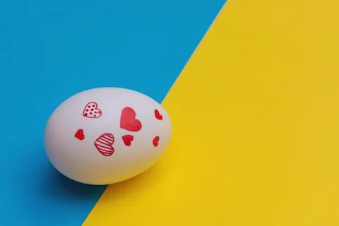 Easter egg on yellow-blue background Stock Photos