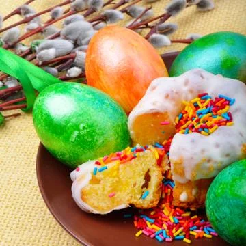 Easter eggs and cake on a plate Stock Photos