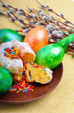 Easter eggs and cake on a plate Stock Photos