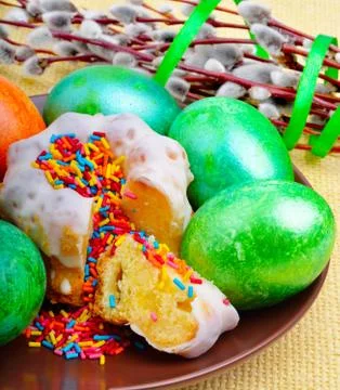 Easter eggs and cake on a plate Stock Photos