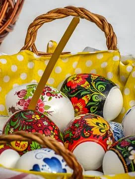 Easter eggs and cakes on lighting near the temple. Stock Photos
