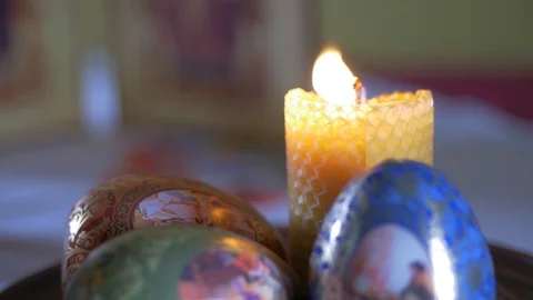 Easter eggs and candle Stock Footage 129429960