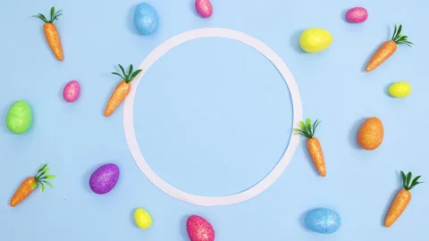 Easter eggs and carrots make creative pattern with copy space. Stop motion 스톡 동영상 149928091