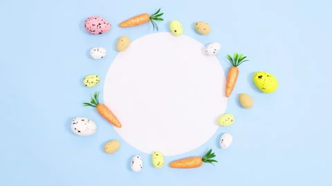 Easter eggs and carrots move around paper card note Minimal flat lay stop motion Stock Footage 149931867