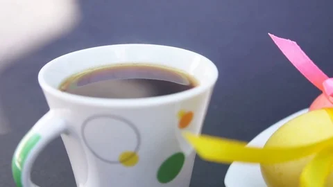 Easter Eggs and Cup of Coffee With Steam Stock Footage 73614394