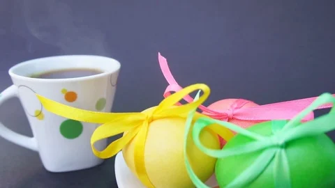 Easter Eggs and Cup of Coffee With Steam Stock Footage 73614754