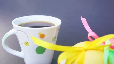 Easter Eggs and Cup of Coffee With Steam Stock Footage 73615380