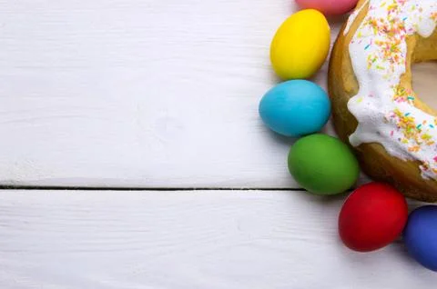 Easter eggs and easter cake on white wooden background Stock Photos
