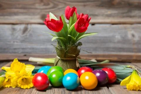 Easter eggs and flowers Stock Photos