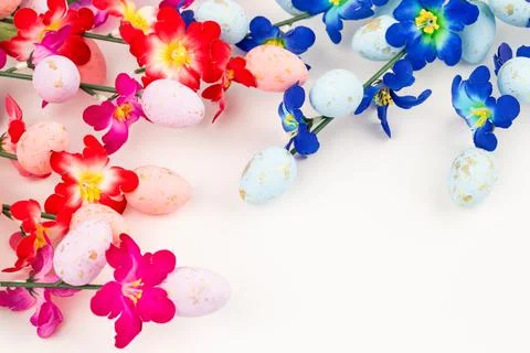 Easter eggs and flowers Stock Photos
