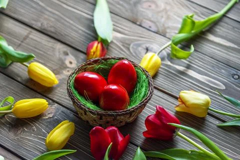 Easter eggs and flowers. Stock Photos