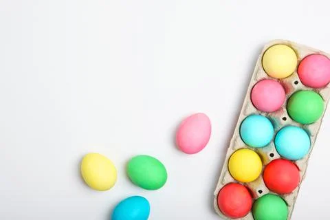 Easter eggs and flowers on the table top view. 写真素材